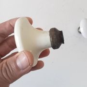 Pair of antique oval door handles in porcelain and brass.