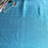 Old damask tablecloth tinted in lagoon blue