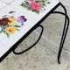 Vintage coffee table in wrought iron with floral tiles.