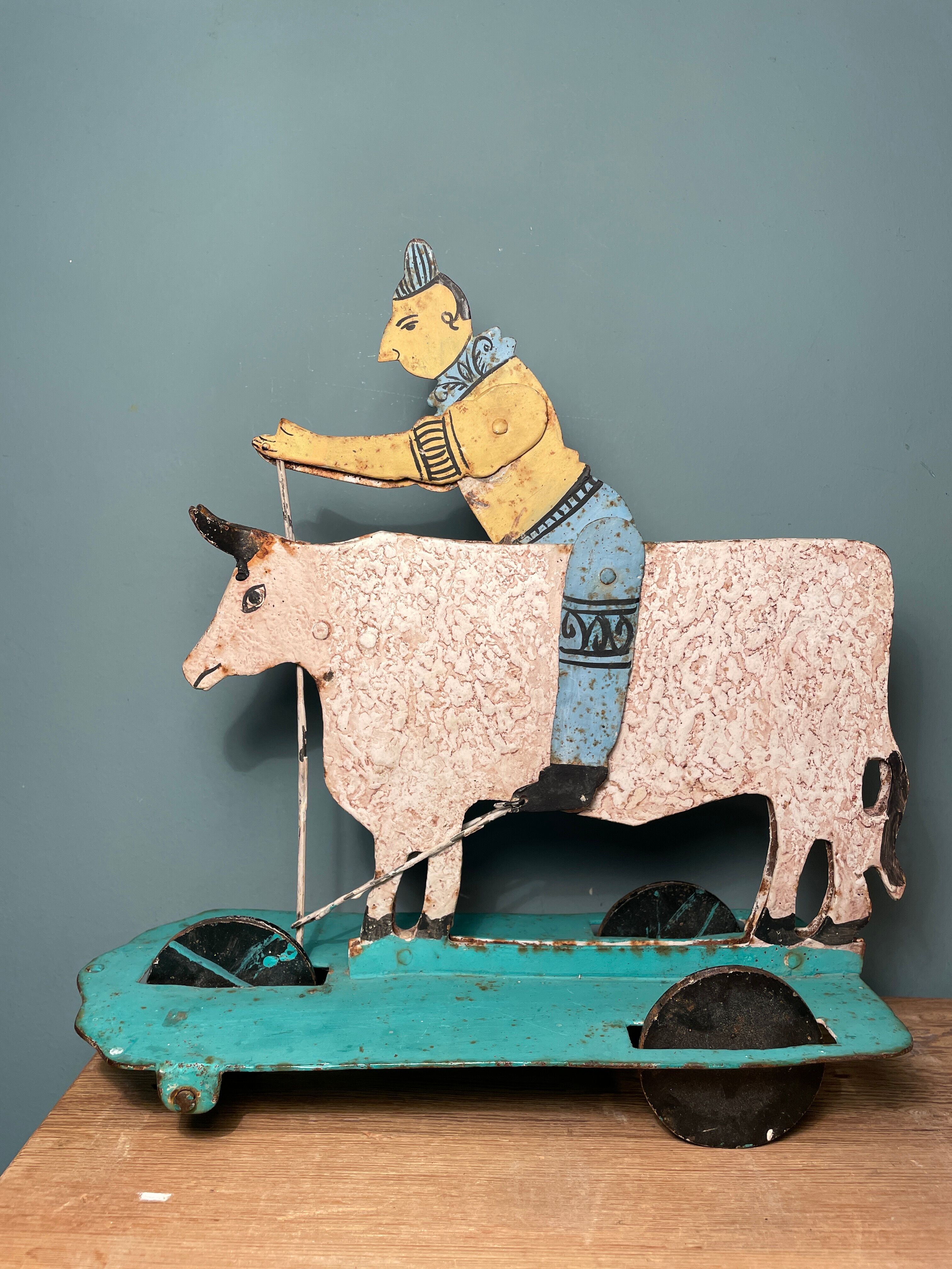 Old painted metal pulling toy