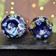 Pair of antique millefiori glass vases attributed to Murano with 2 handles.