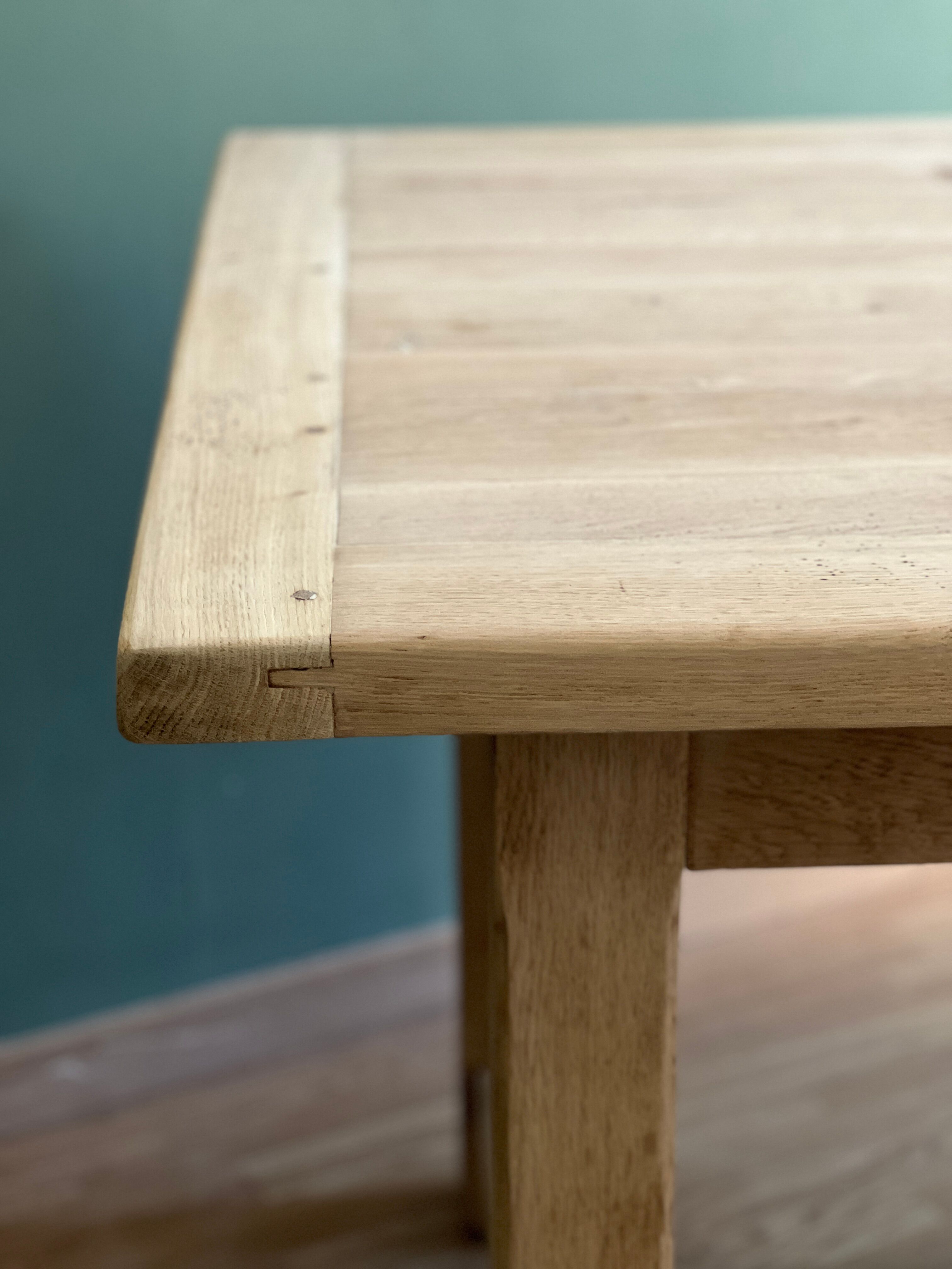 Farm table made of solid light oak wood.