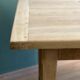 Farm table made of solid light oak wood.