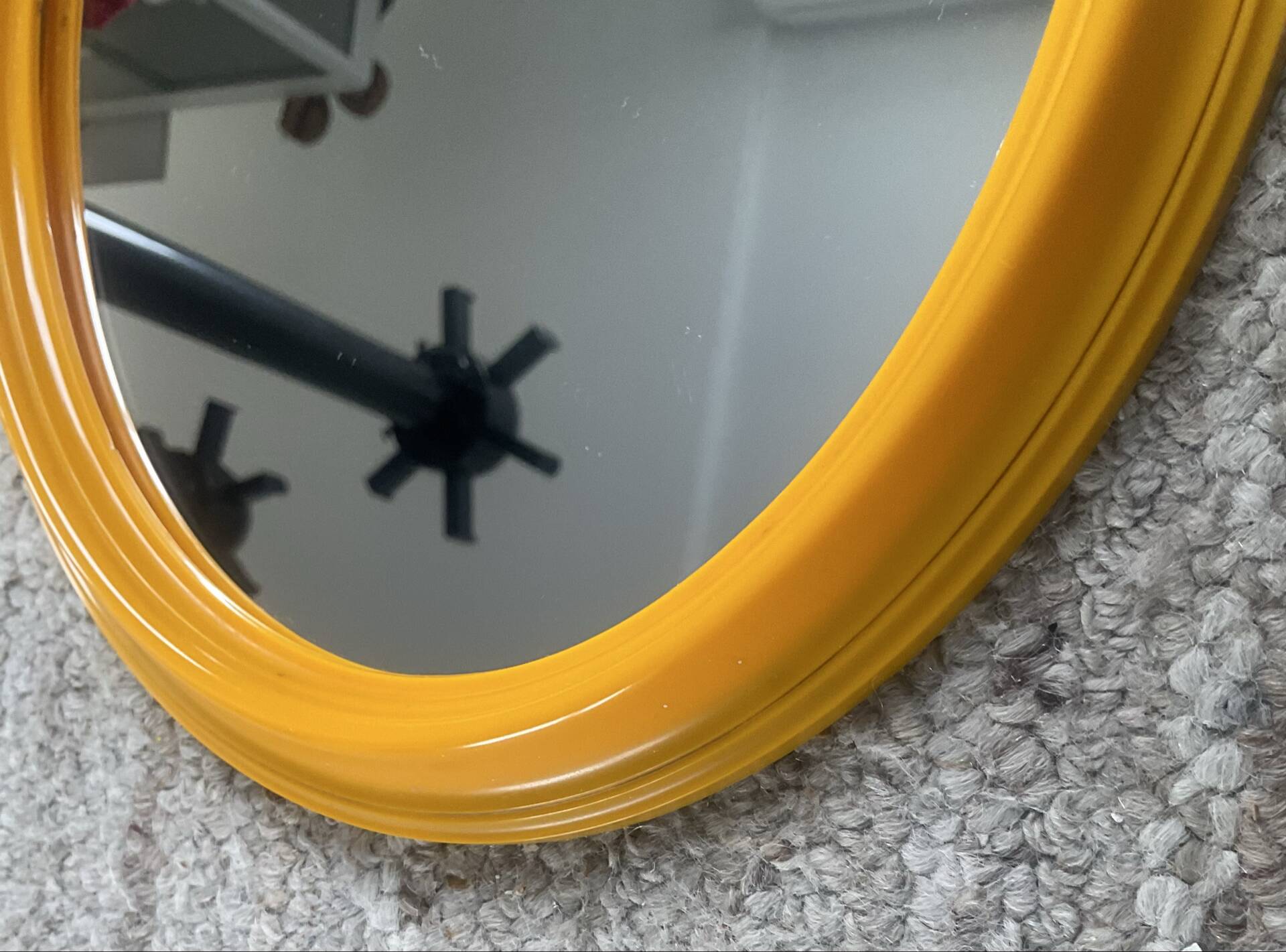 Vintage oval mirror from the 1970s.