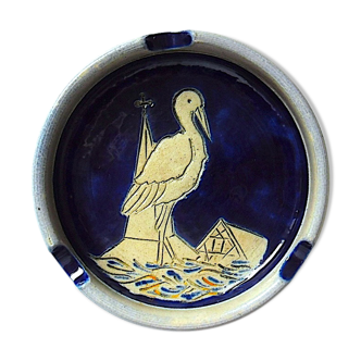 Salt-centered sandstone ashtray of a stork