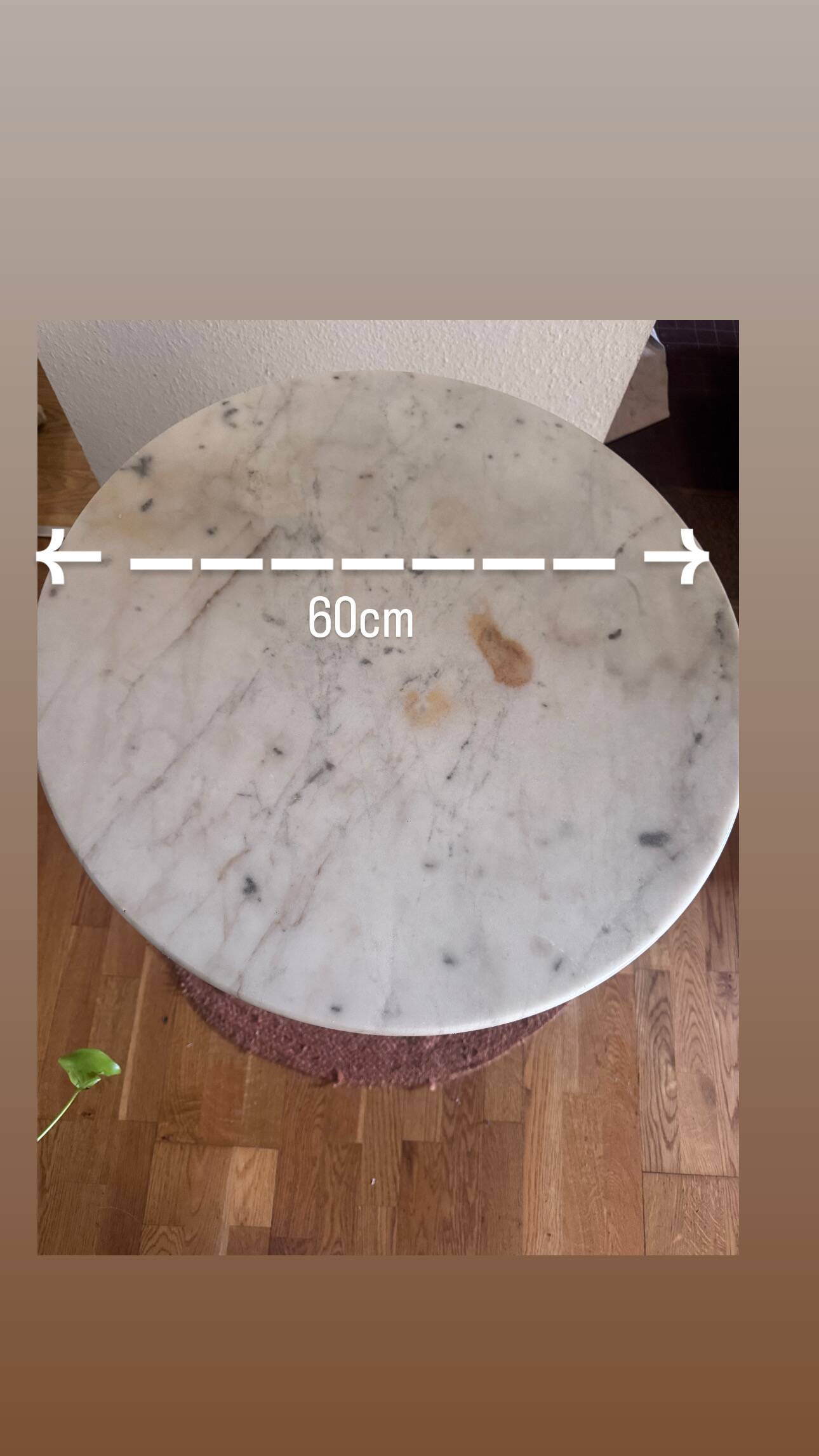 Marble side table with a cast iron base.