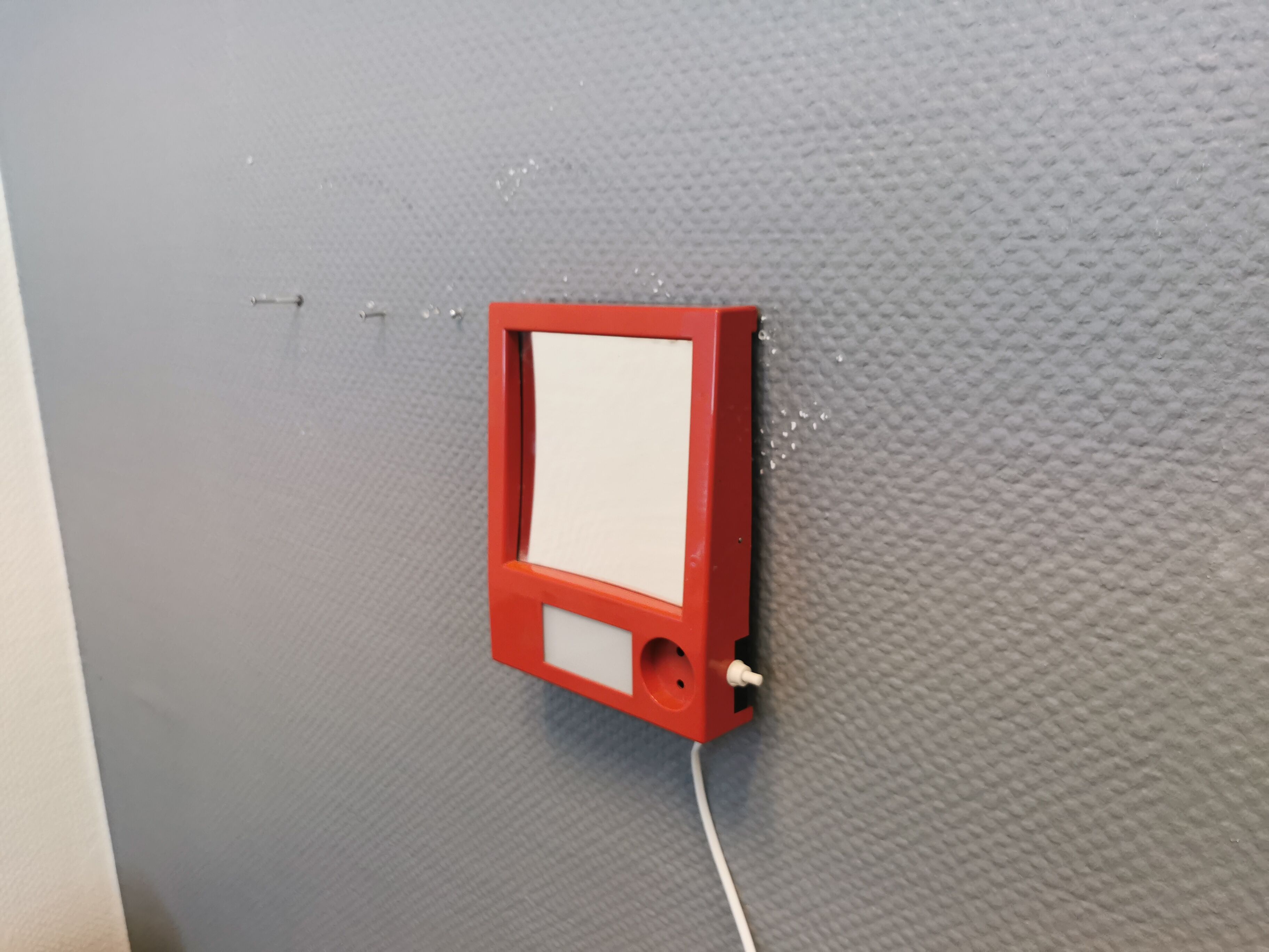 Red danish make up mirror with light and power plug from the 1970