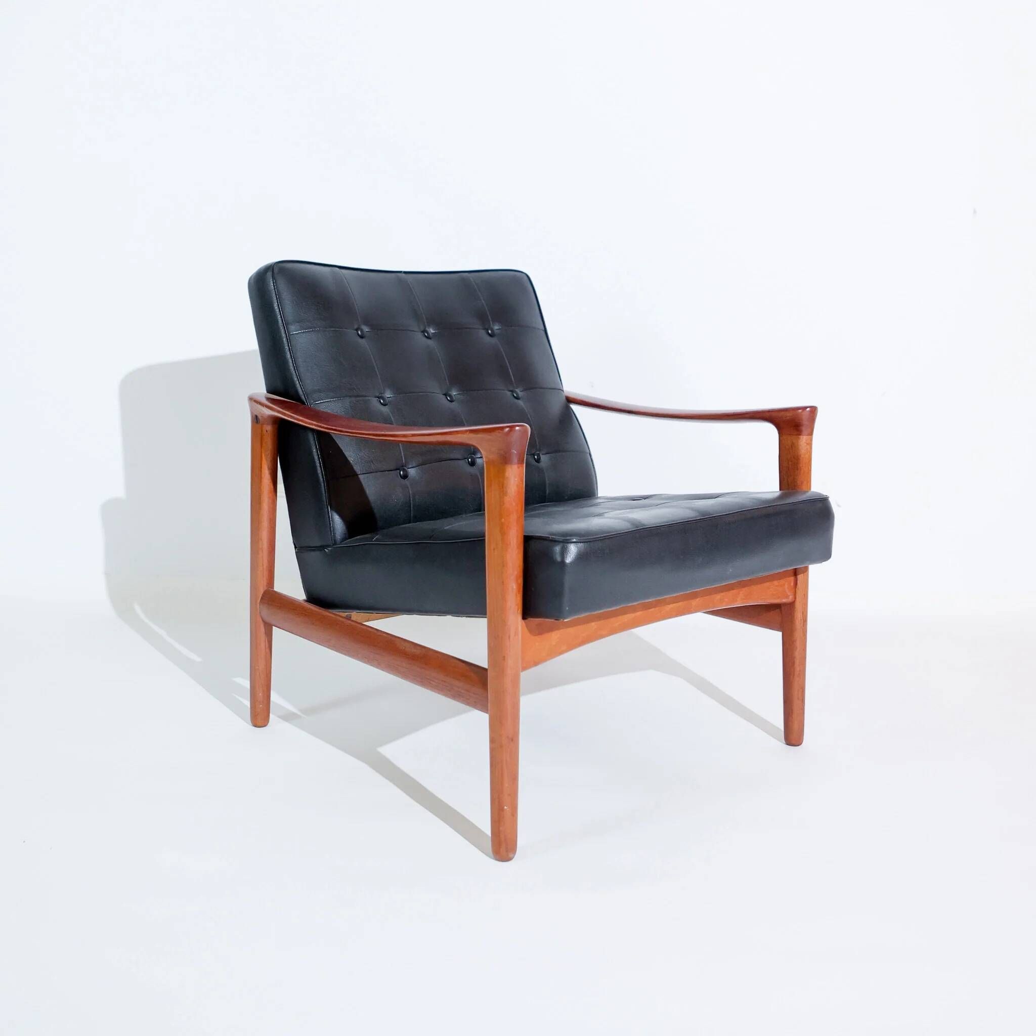 Vintage Scandinavian lounge chair by Bröderna Andersson, teak and black faux leather upholstery, 1950s-1960s.