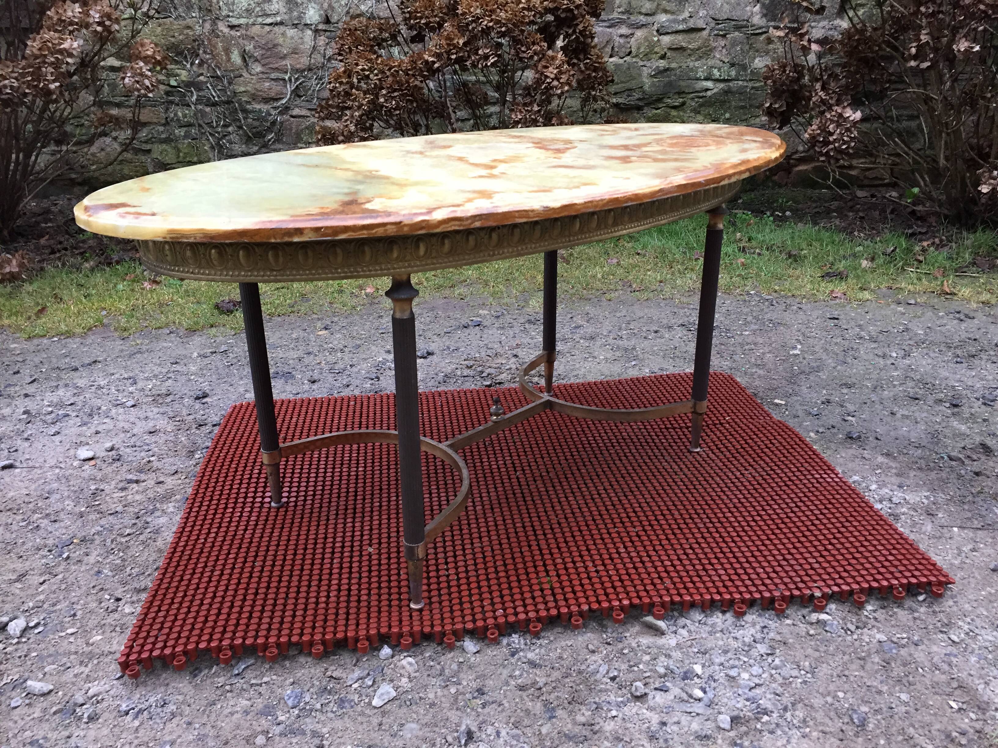 Vintage brass coffee table and oval alabaster top.