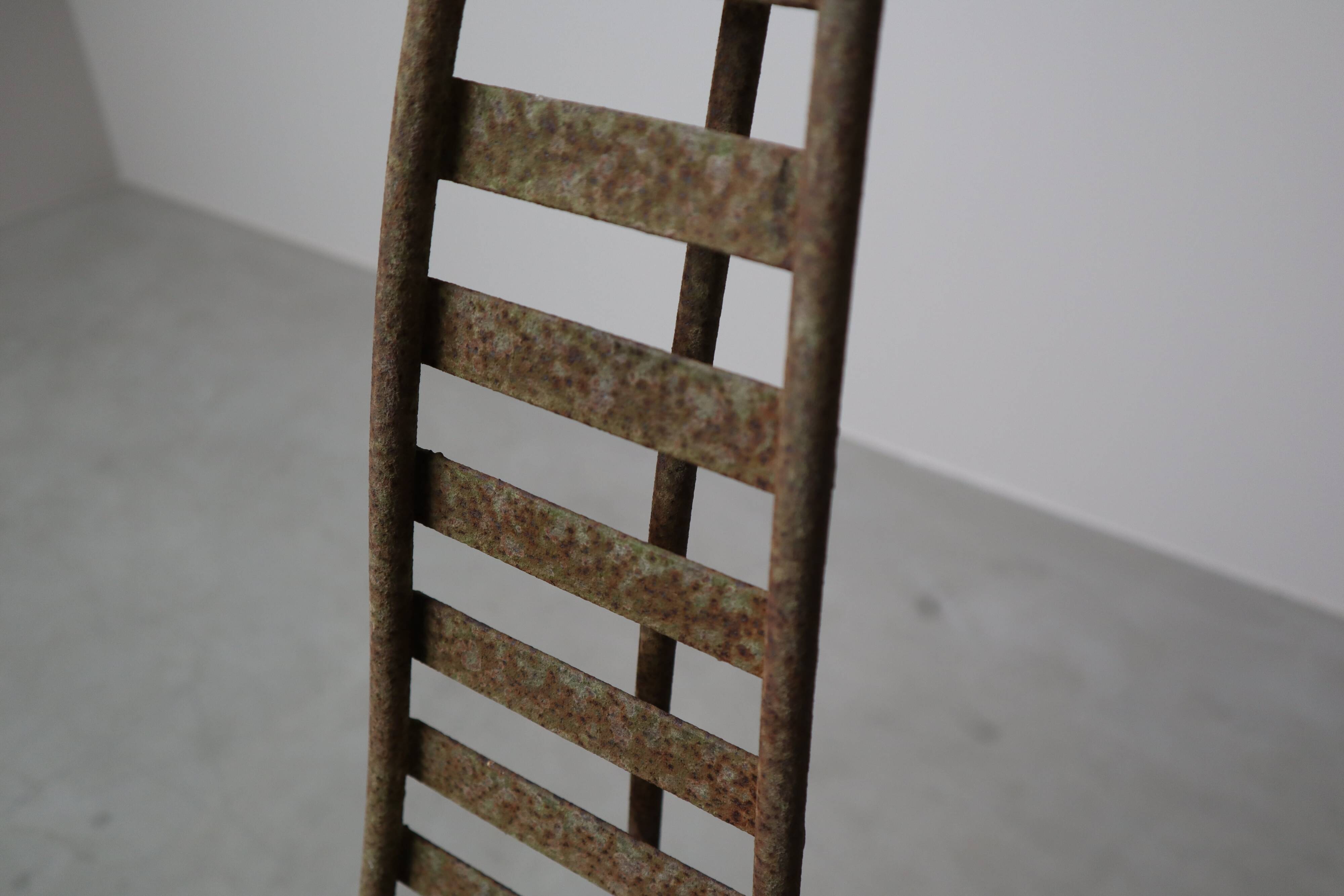 Set of three sculptural iron chairs