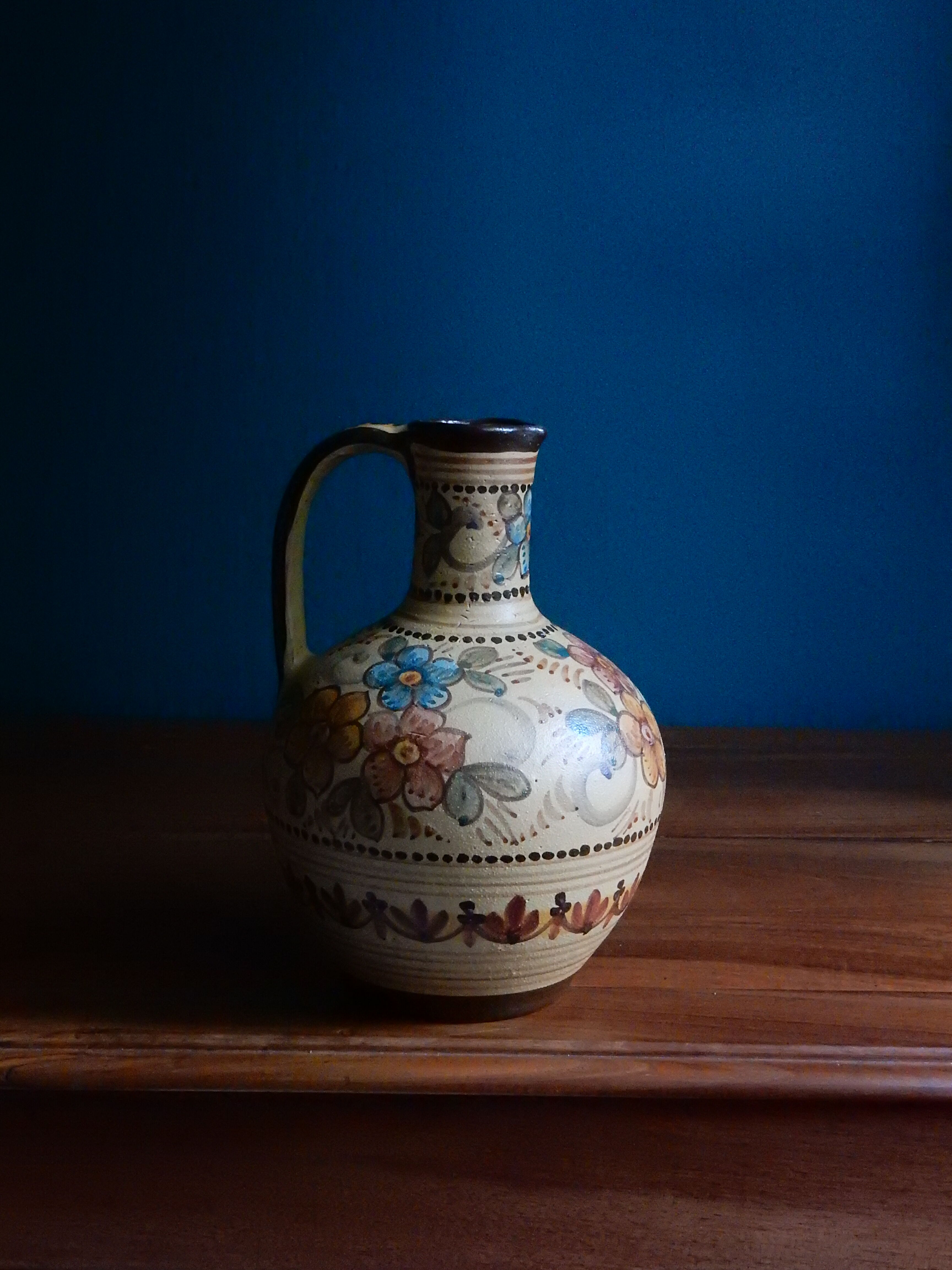 Hand-painted terracotta jug