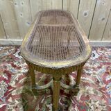 Bench - Piano bench in caning and gilded wood in the Louis XVI style.
