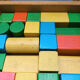 Walking trolley with multicolored wooden cubes