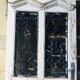 Old door with wrought iron grille