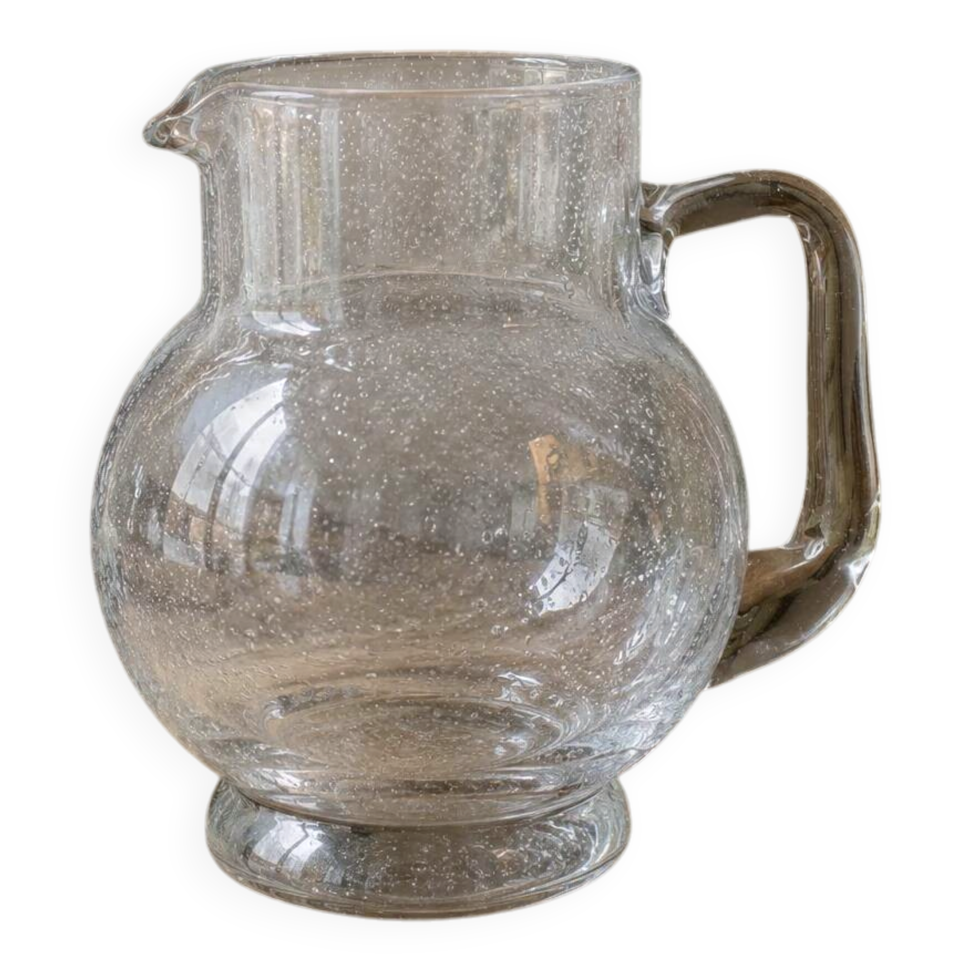 Vintage blown glass pitcher with bubbles, transparent.