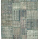 Hand-knotted turkish vintage 175 cm x 244 cm blue patchwork carpet