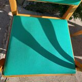 3 vintage bridge chairs with rounded armrests.