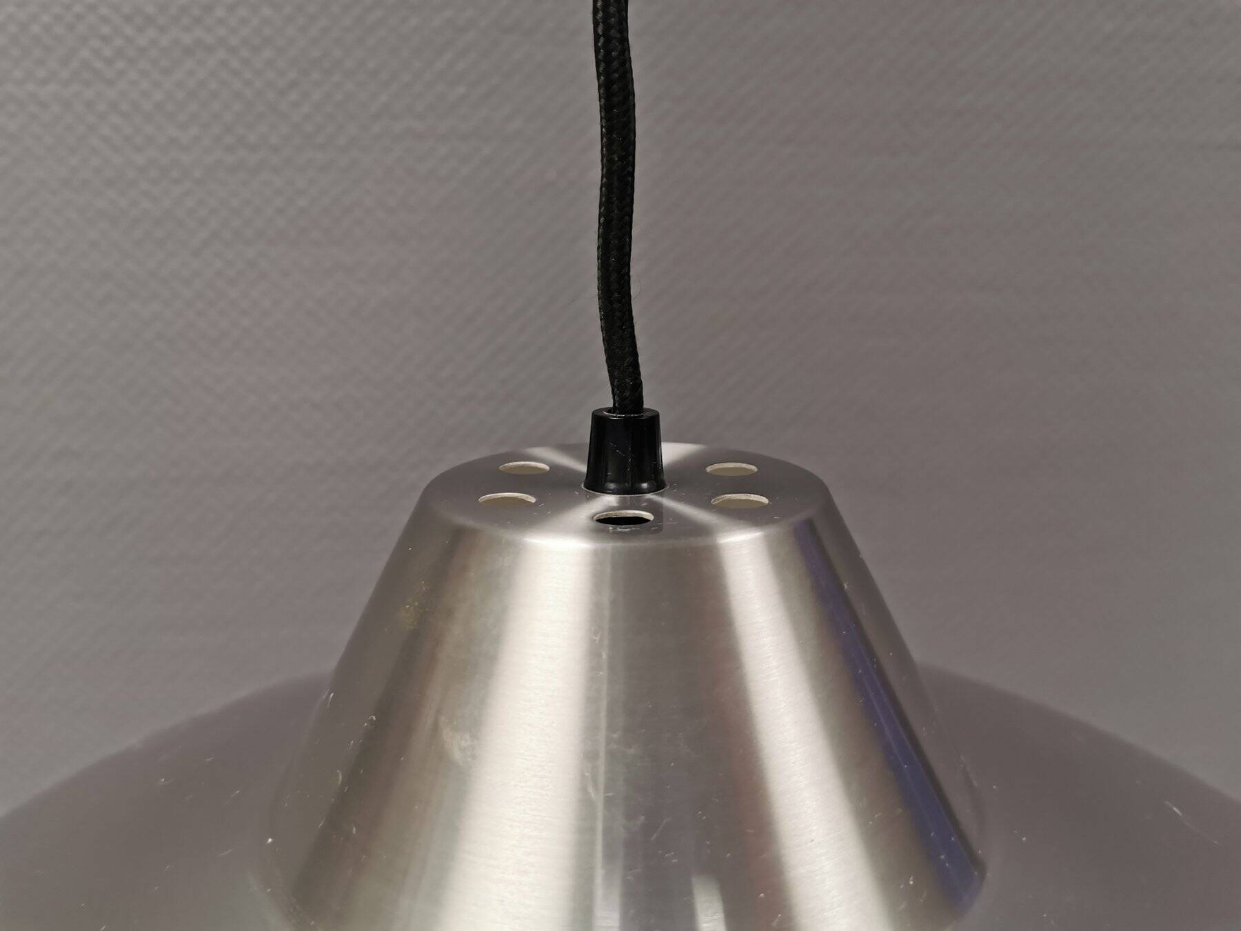 Slim silver-colored hanging lamp with a large diameter. Denmark 1980s