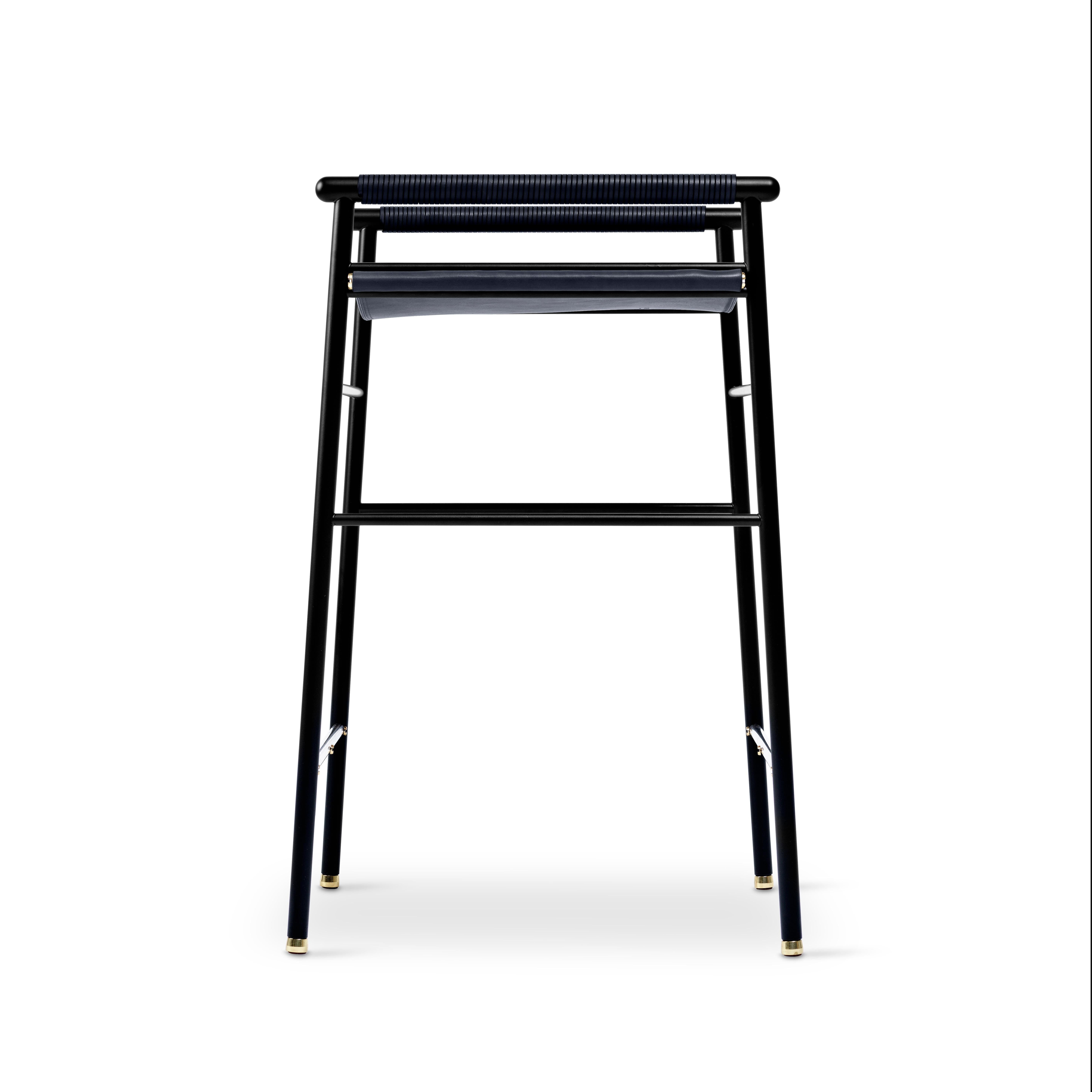 Contemporary artisan bar stool in navy blue leather and black rubber metal.