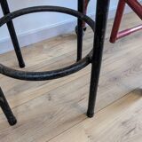 Old black industrial stool