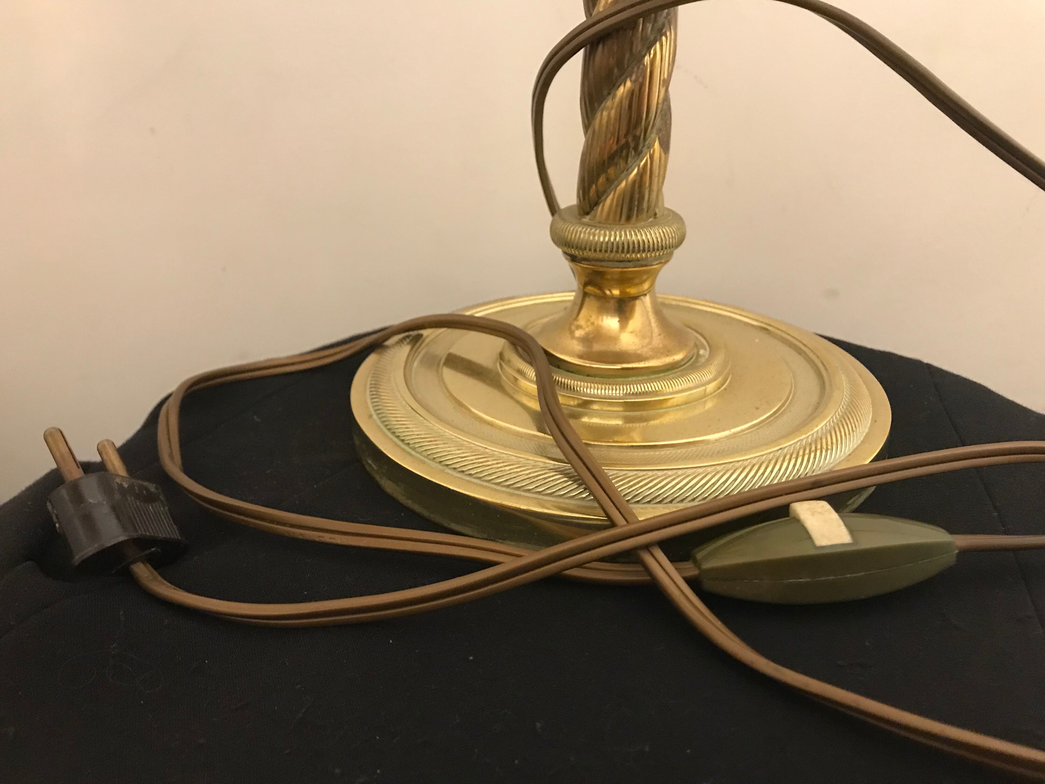 Brass lamp with removable ring around a globe