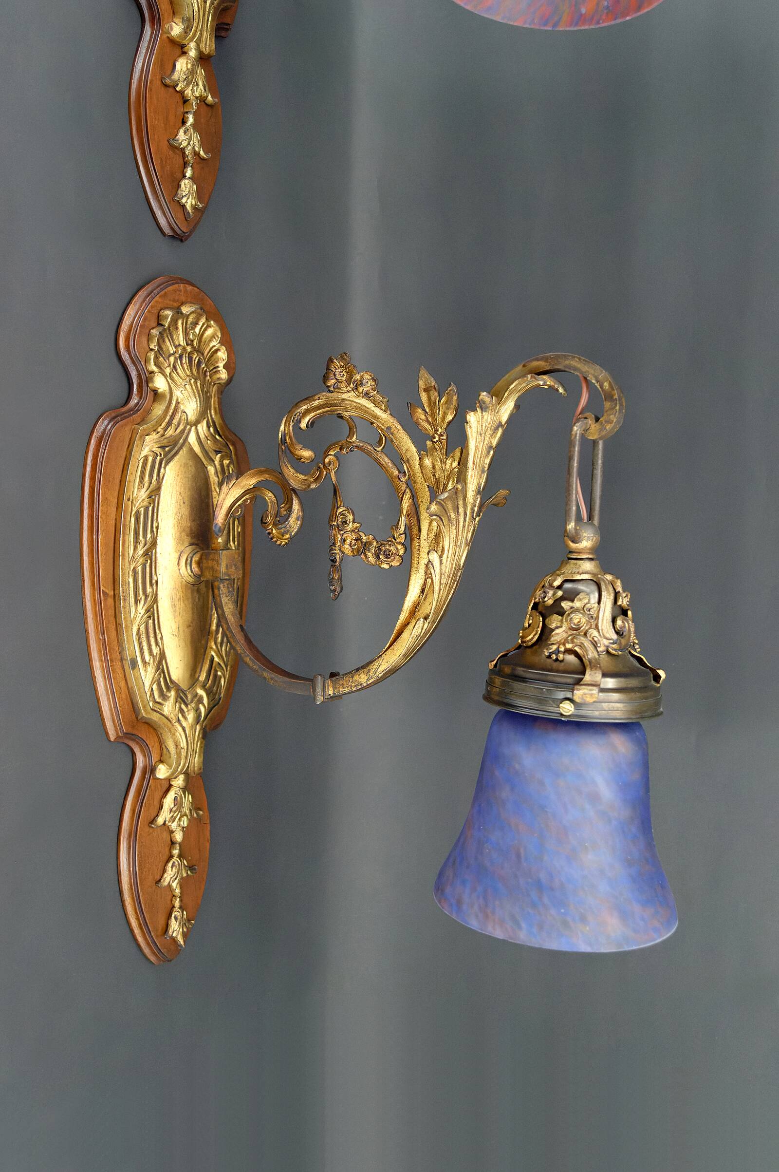 Pair of Rococo / Louis XV wall lights in gilded bronze, walnut bases and glass tulips, France, Circ