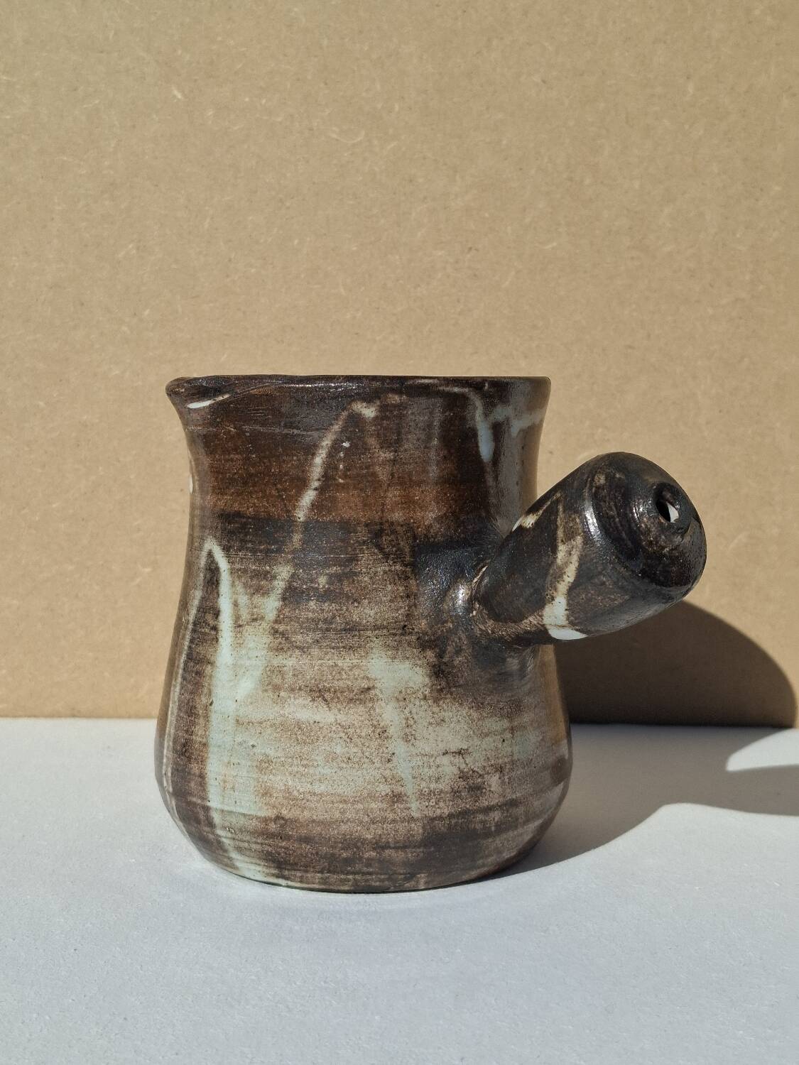 Stoneware pitcher signed by Jacques Pouchain.