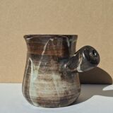 Stoneware pitcher signed by Jacques Pouchain.