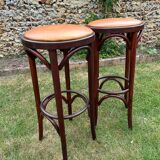 Pair of curved wooden bistro stools with leather seats