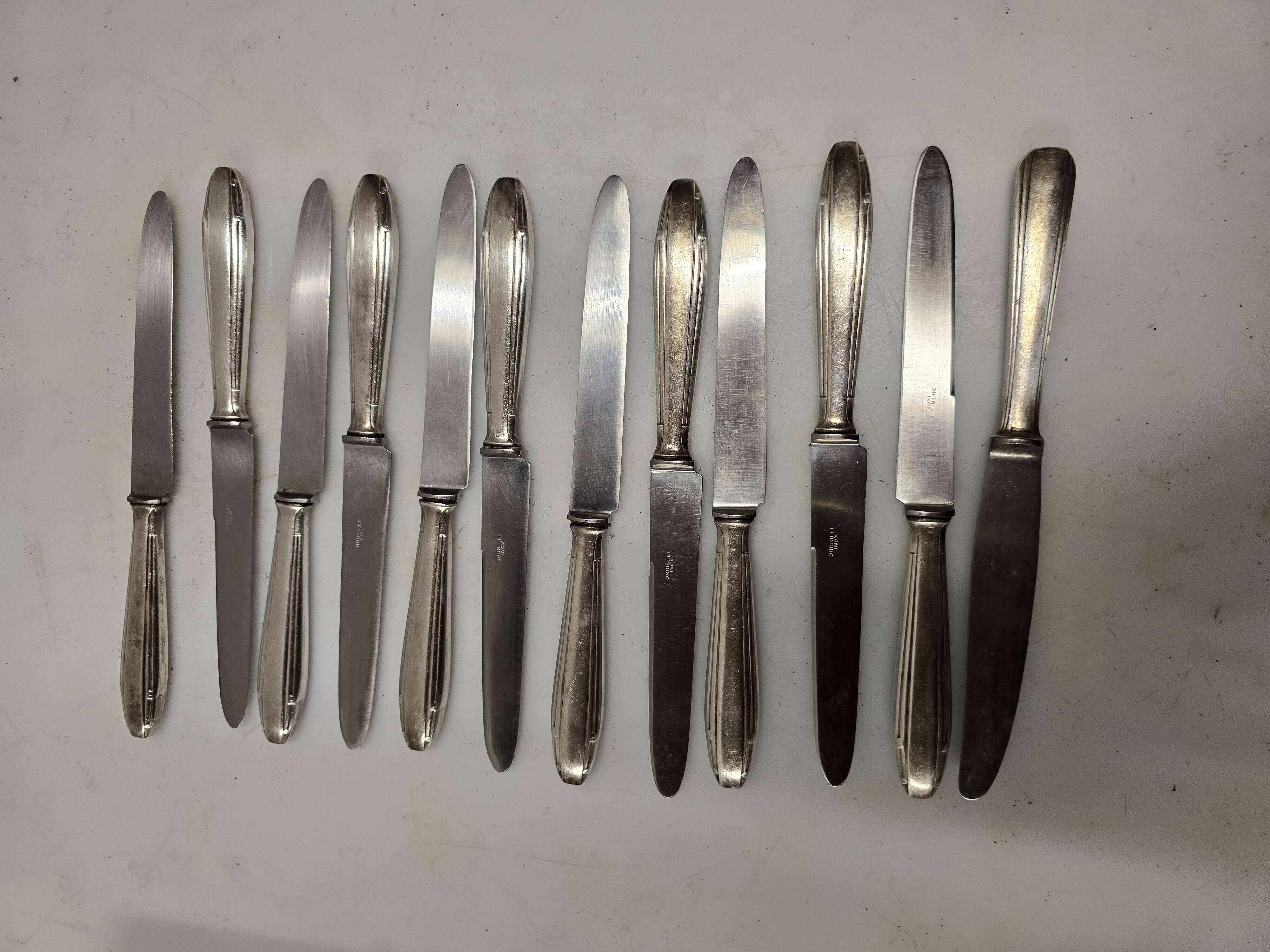 12 silver-plated knives from the mid-20th century