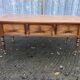 Solid cherry game table with 2 front drawers and panelled crosspieces.