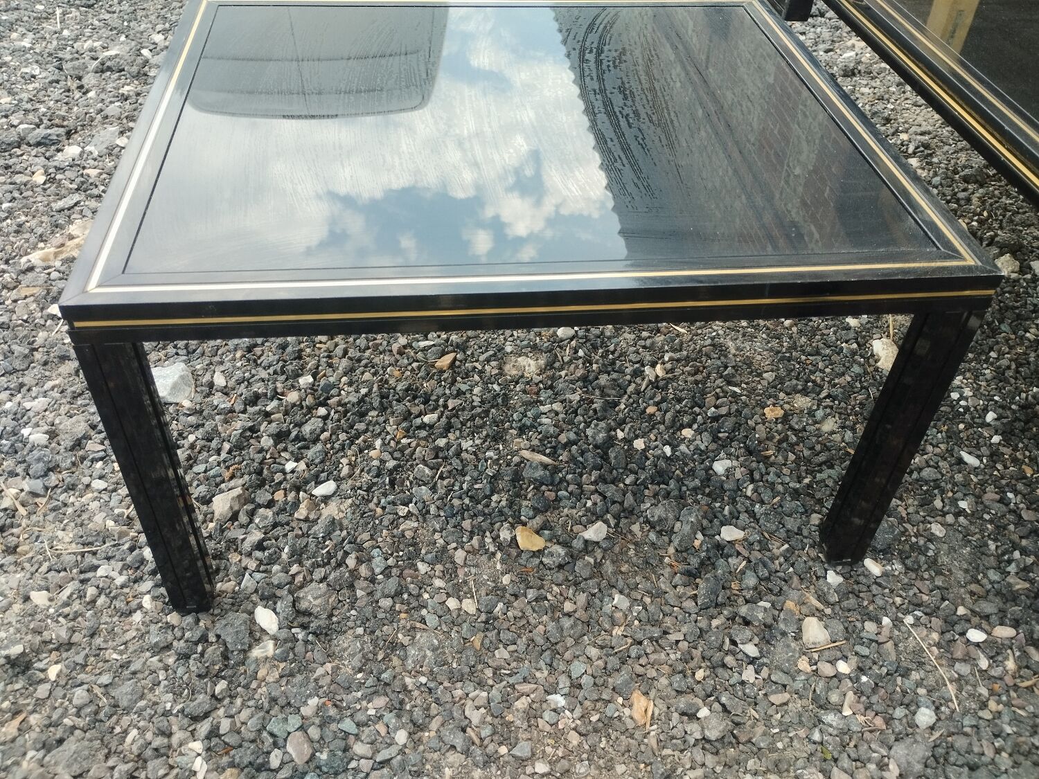 Vintage metal coffee table with glass top.