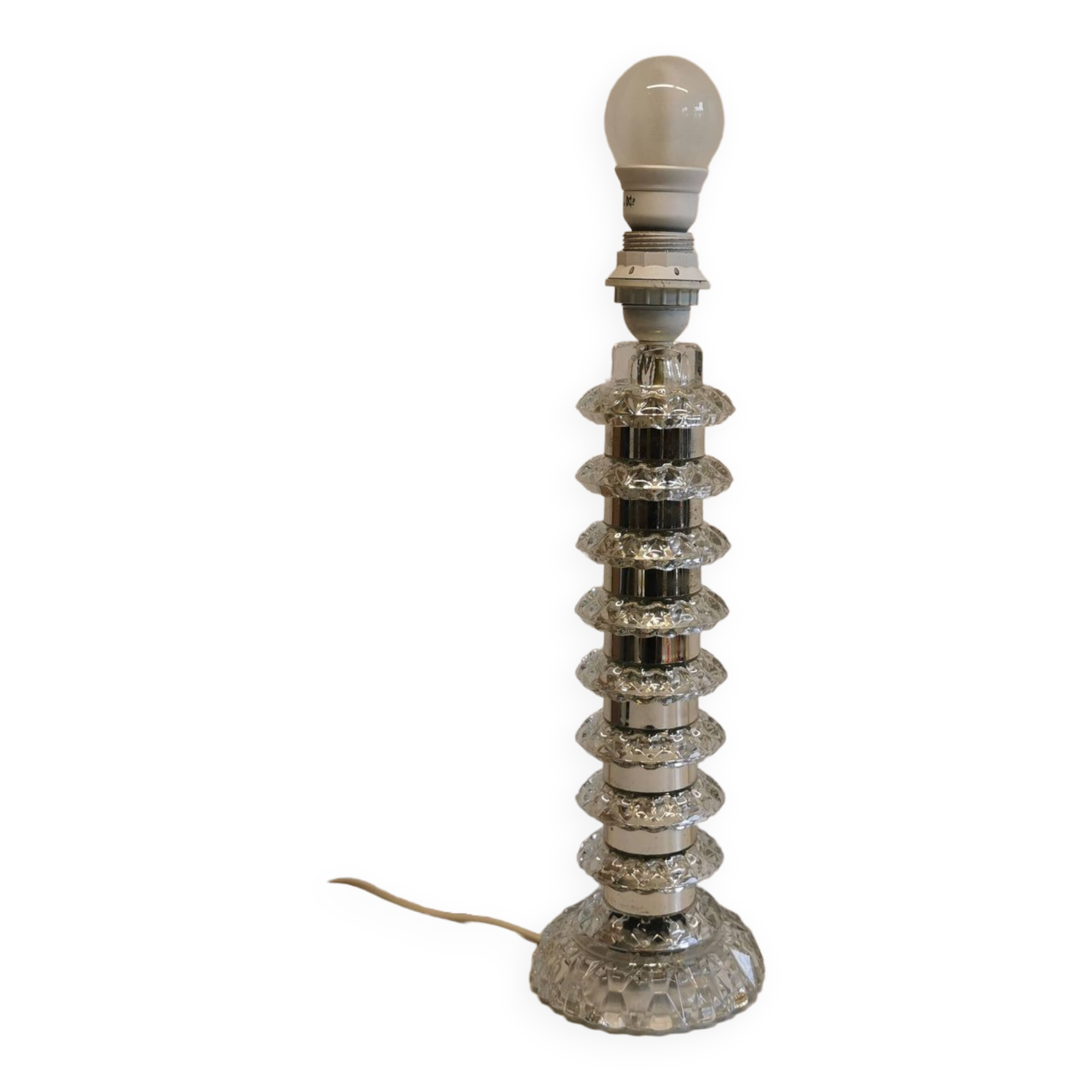 Table lamp made of transparent crystal glass and silver colored spacers.