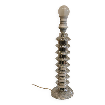Table lamp made of transparent crystal glass and silver colored spacers.