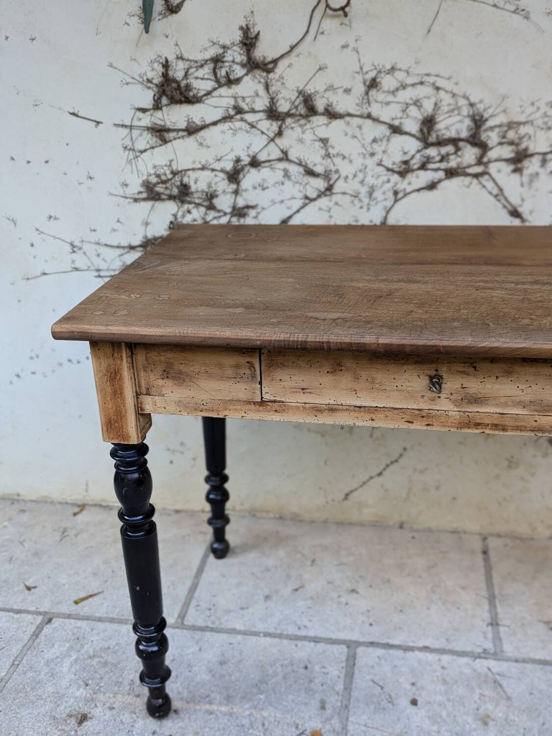 Solid wood desk, black base