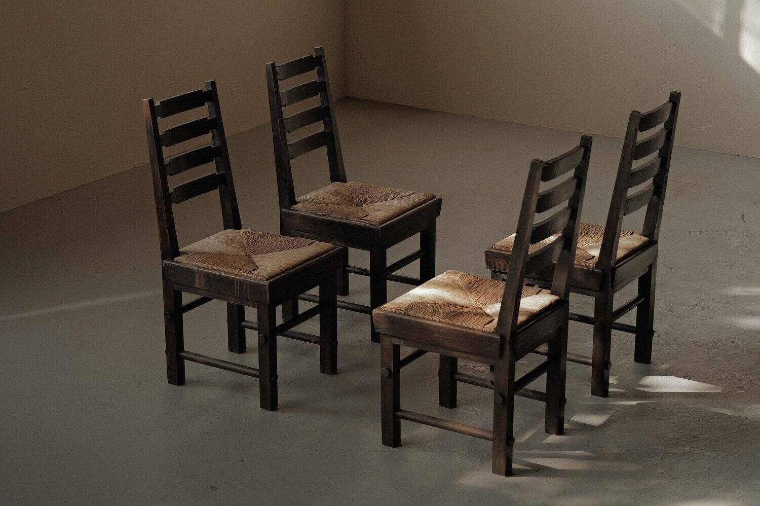 Modernist chairs in oak and woven straw, France, circa 1948