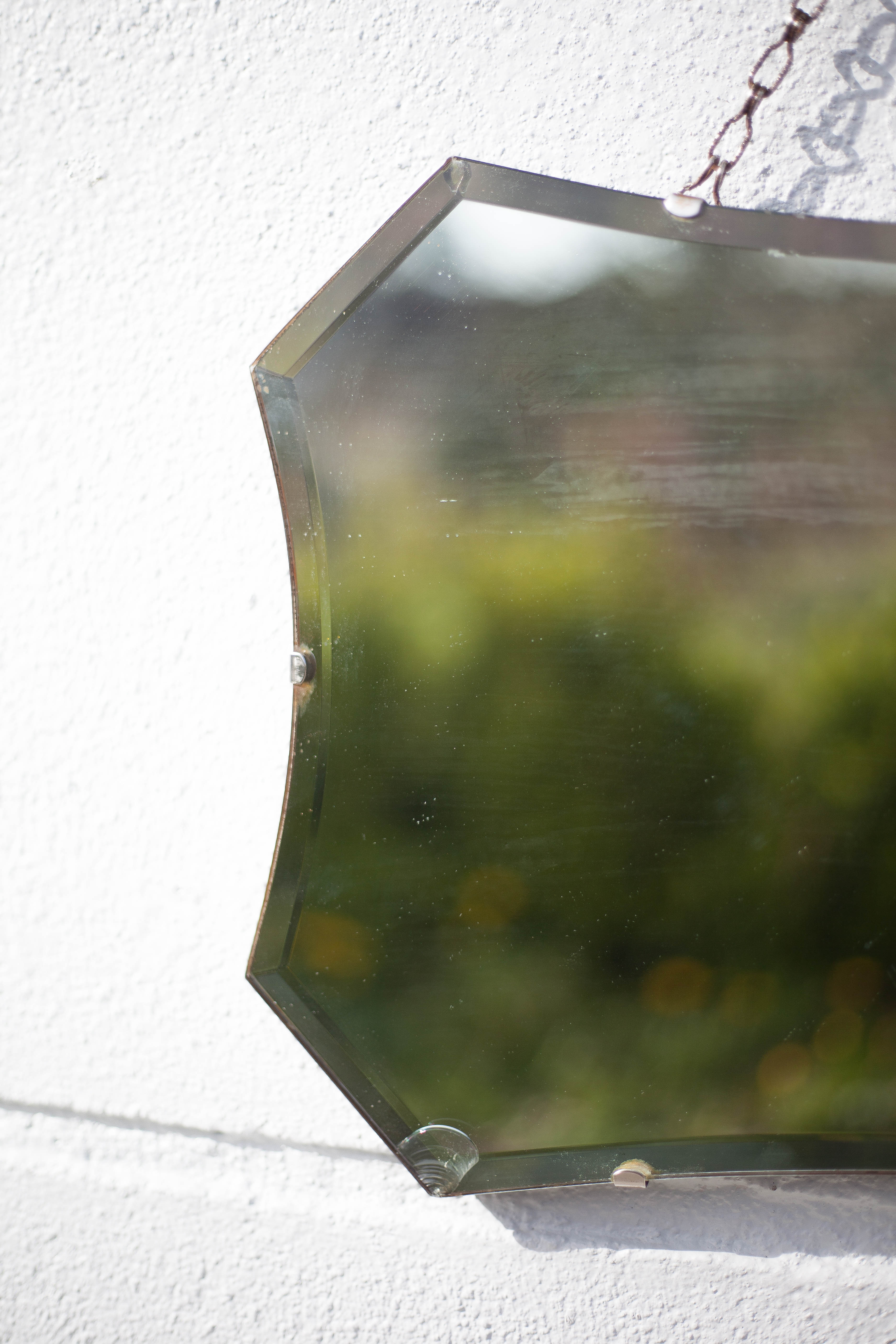Vintage wall mirror with beveled chain