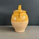 Ancient oil jar in glazed terracotta