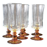 6 amber-footed champagne flutes in very good condition.