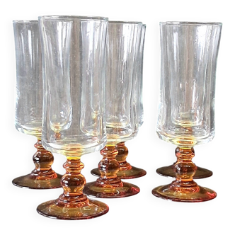 6 amber-footed champagne flutes in very good condition.