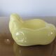 Empty hand-shaped pocket in pale yellow ceramic years70