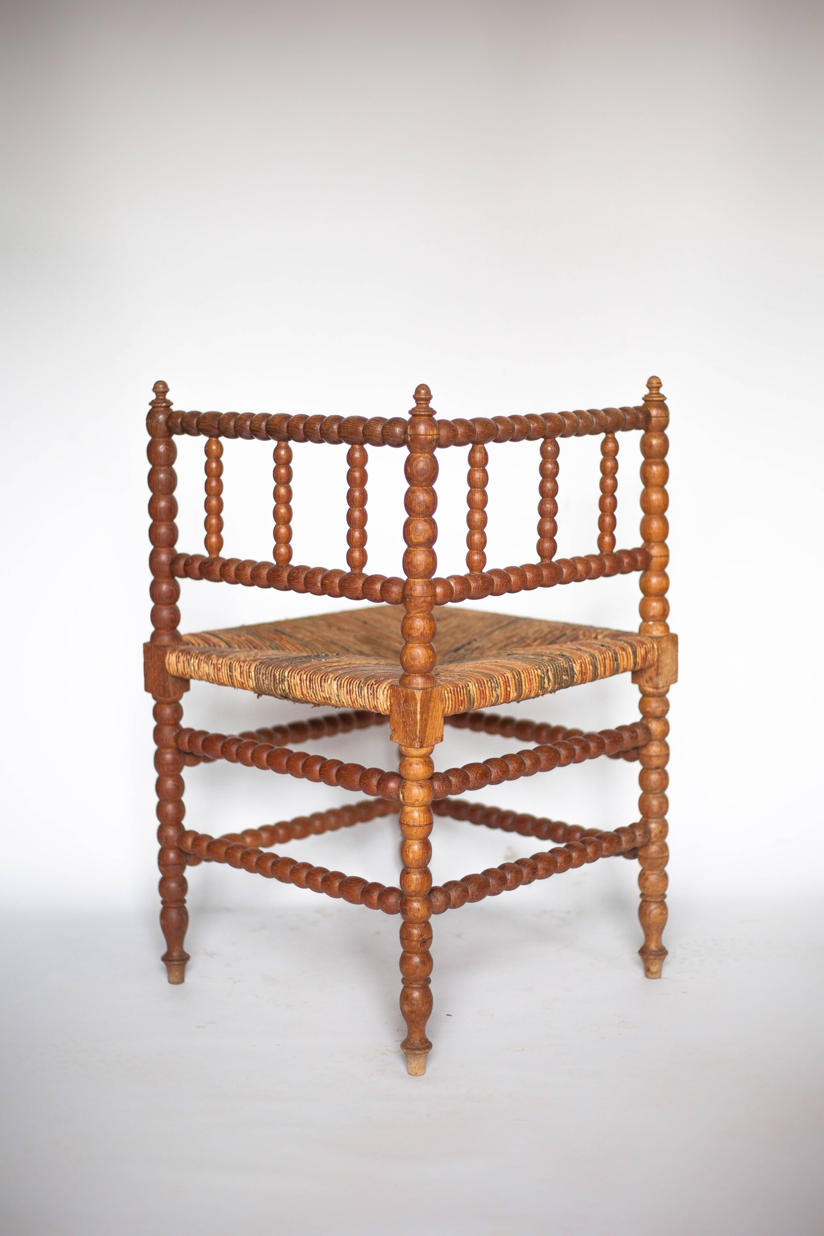Wooden and caned corner chair, antique bobbin chair, occasional chair.