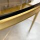 Mid-century Hollywood Regency style coffee table in brass and glass, made in Germany by Vereinigte Werkstätten, 1960s.