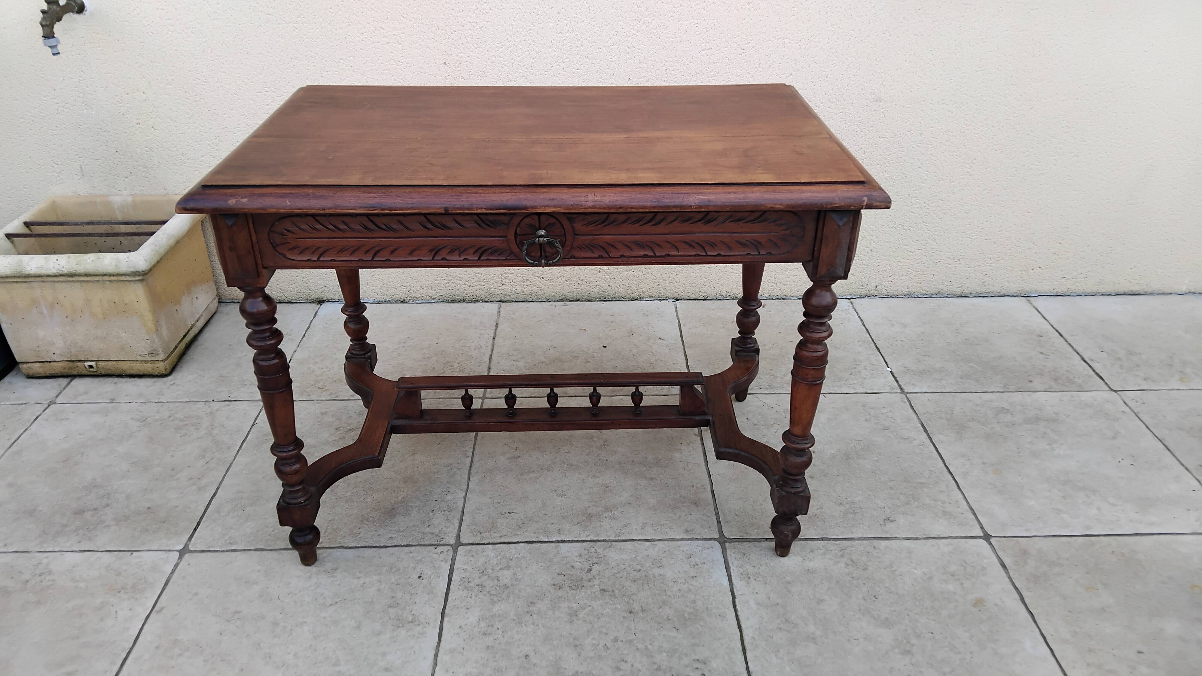 Antique desk or small table in solid carved wood