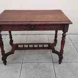 Antique desk or small table in solid carved wood