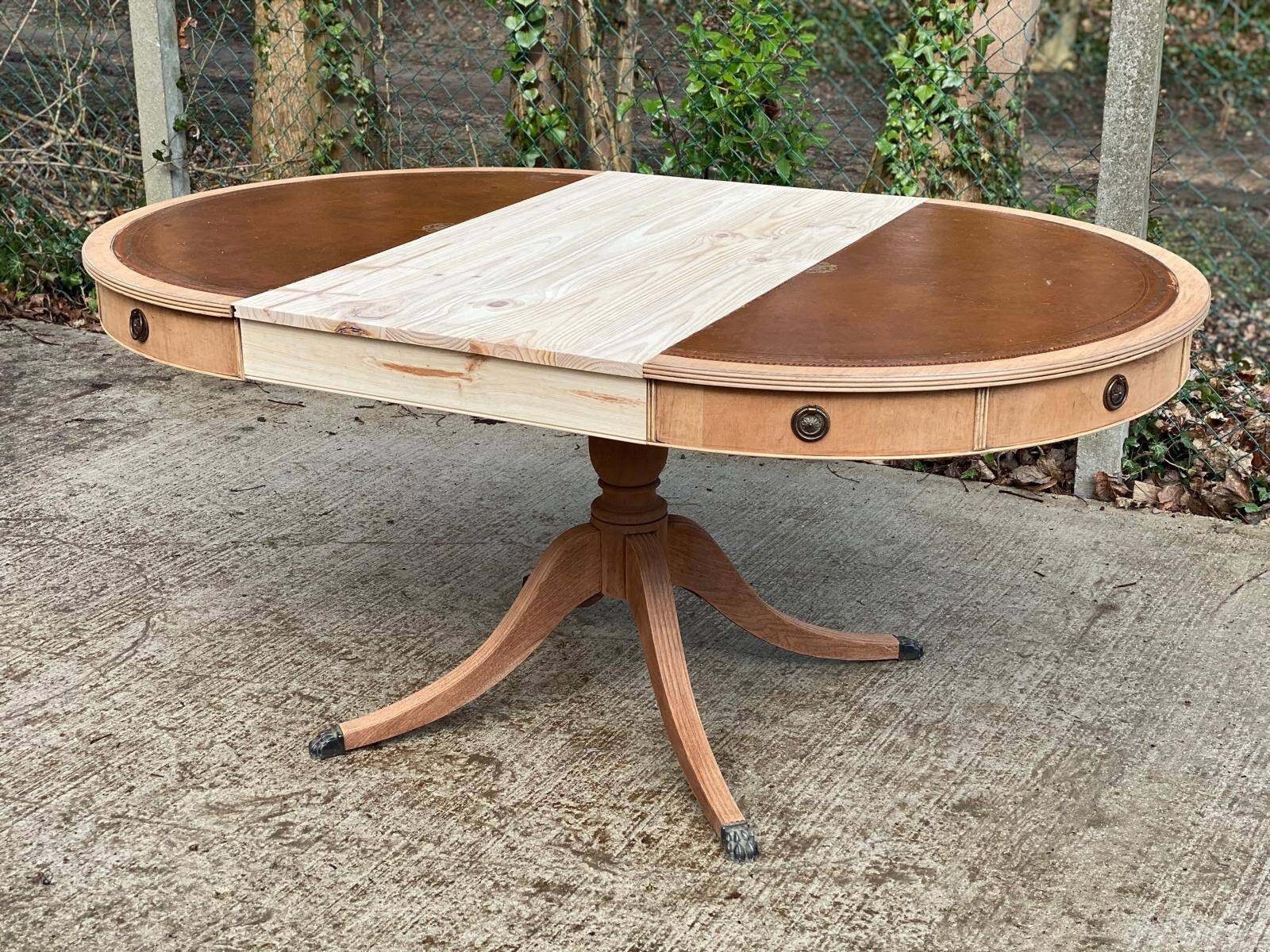 Round extendable table in Empire style, renovated with Bordeaux leather and raw wood, 168cm.