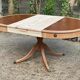 Round extendable table in Empire style, renovated with Bordeaux leather and raw wood, 168cm.