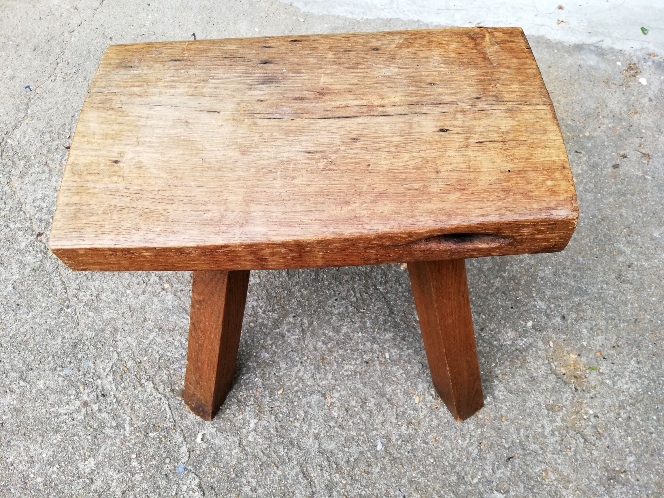 Old farm stool raw wood tripod