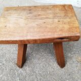 Old farm stool raw wood tripod
