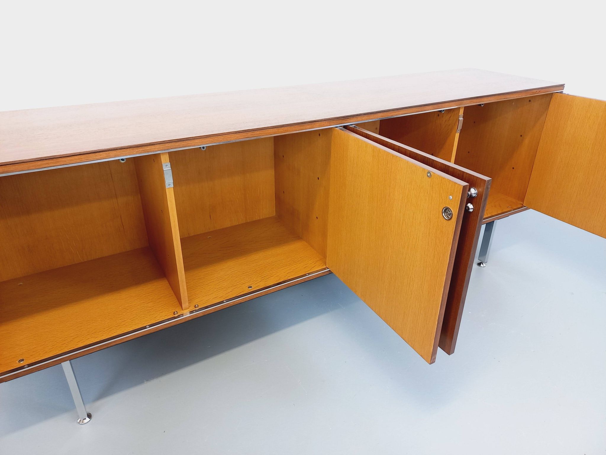 Vintage modernist enfilade in rosewood and chrome metal from the 60s and 70s.